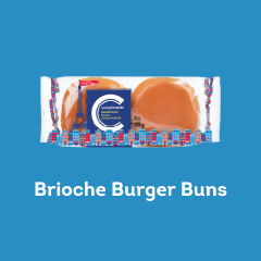 Clear plastic wrapped package with blue Compliments label containing 4 brioche hamburger buns